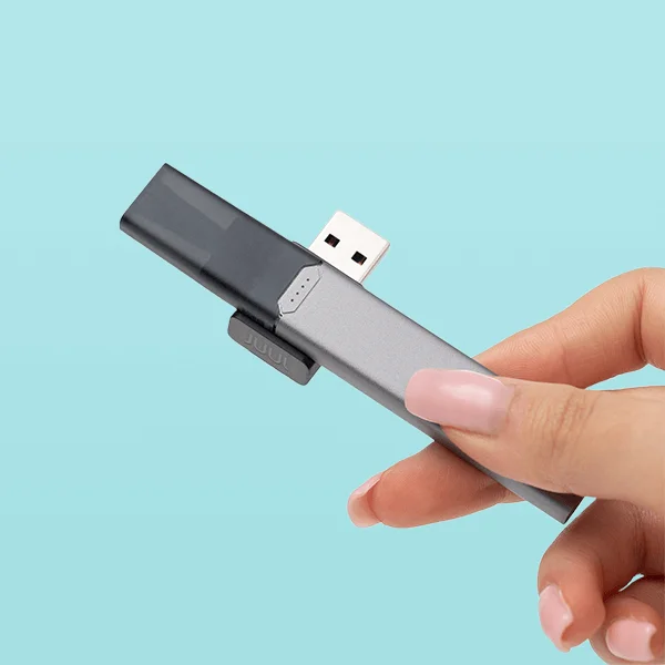 JUUL2 device sitting in its magnetic charging dock connected via USB-C