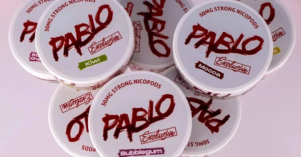Pablo Exclusive nicotine pouches range on pink background