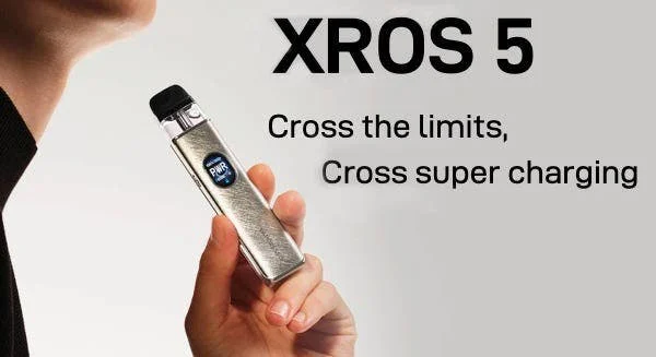 Vaporesso XROS 5 refillable pod kit held in the hand, HD screen lit
